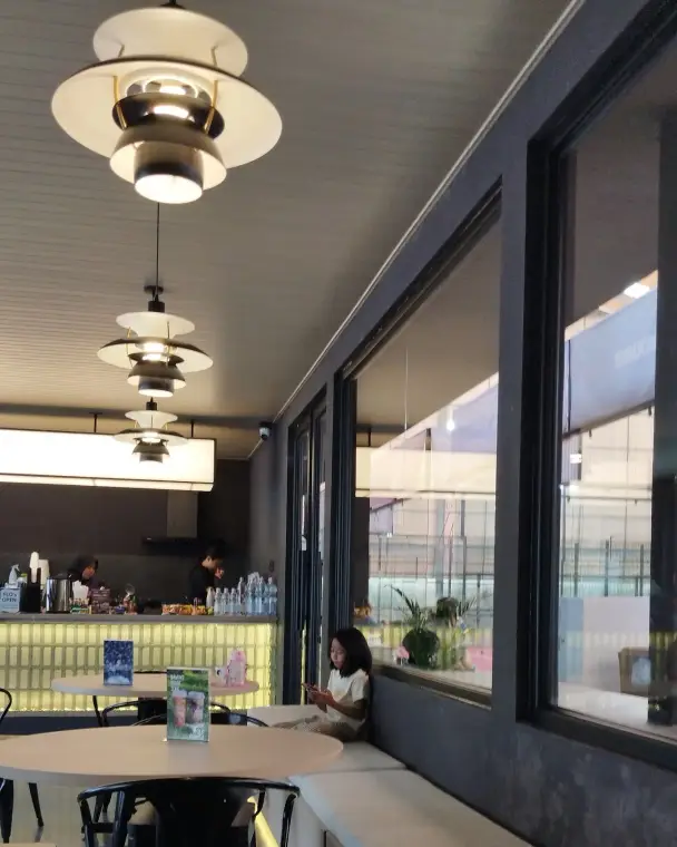 Full-AC café with pendant lights