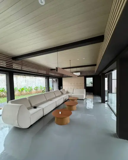 Long lounge with white sofas